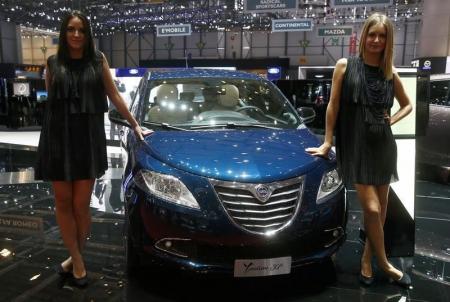 Models pose next to a Lancia Ypsilon 30th anniversary edition during the second press day ahead of the 85th International Motor Show in Geneva